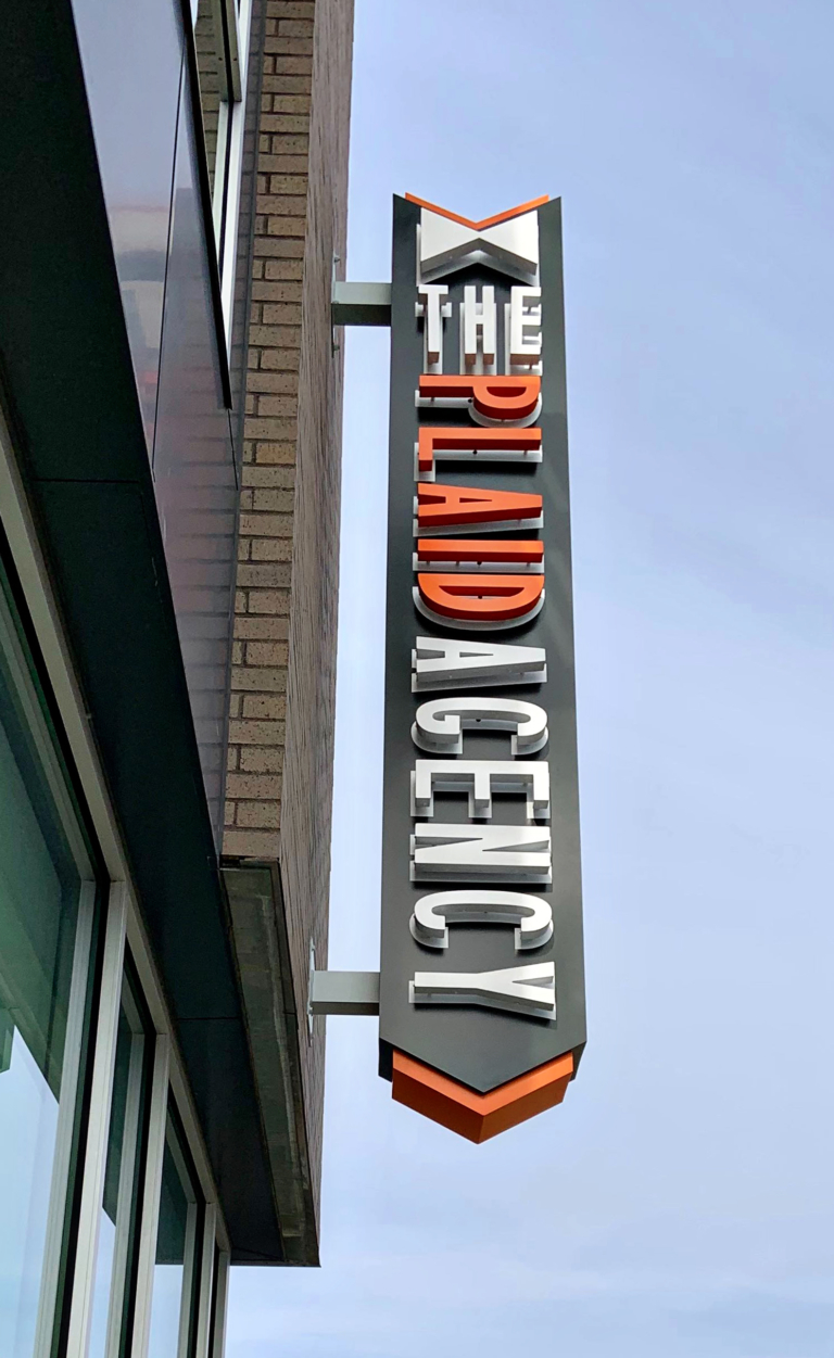 THE PLAID AGENCY Projecting Sign